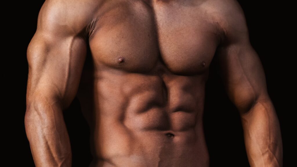 mans chest with black background