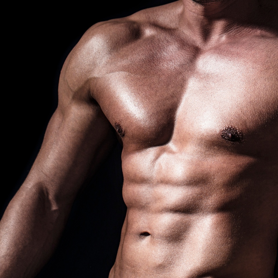 Sexy torso. Handsome big muscles man posing at studio. Muscular sexy man. Handsome sexual strong man with muscular body. Torso with six pack and ab muscle. Abs and biceps. Strong brutal guy.